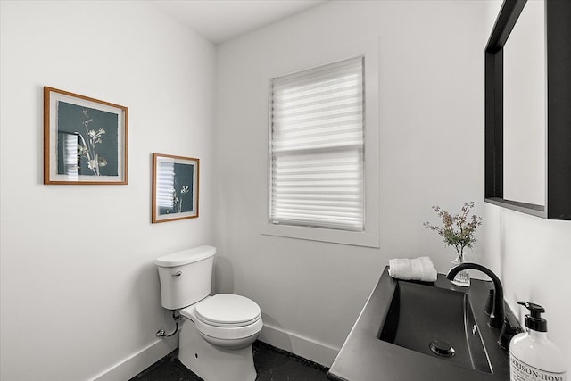 bathroom with toilet and sink