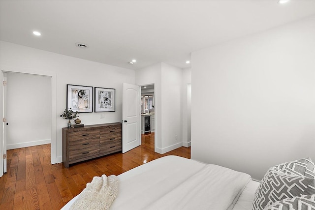 bedroom with dark wood-type flooring