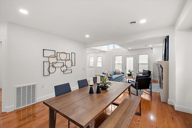 dining space with light wood-type flooring