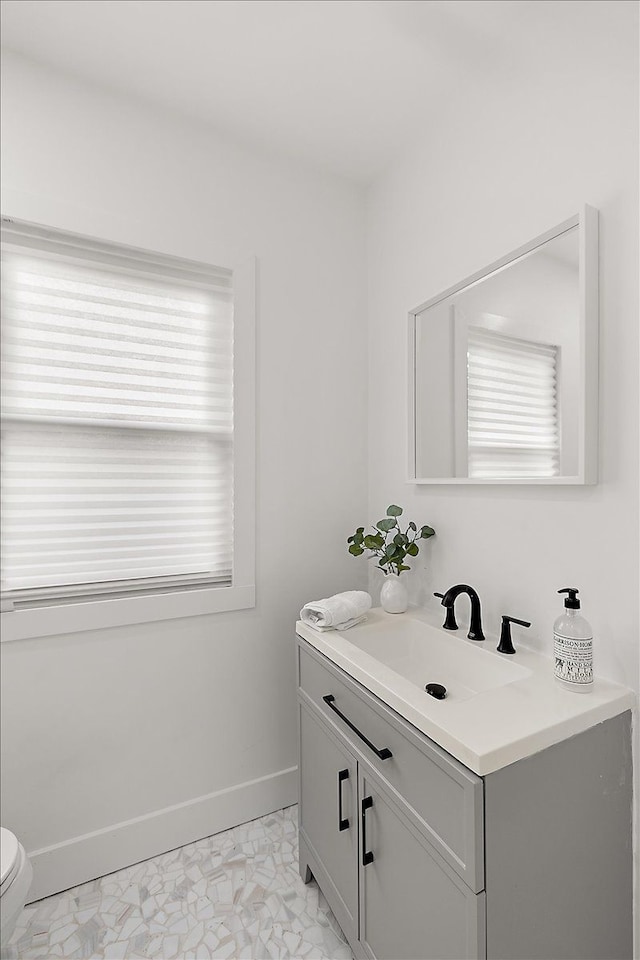 bathroom with vanity and toilet