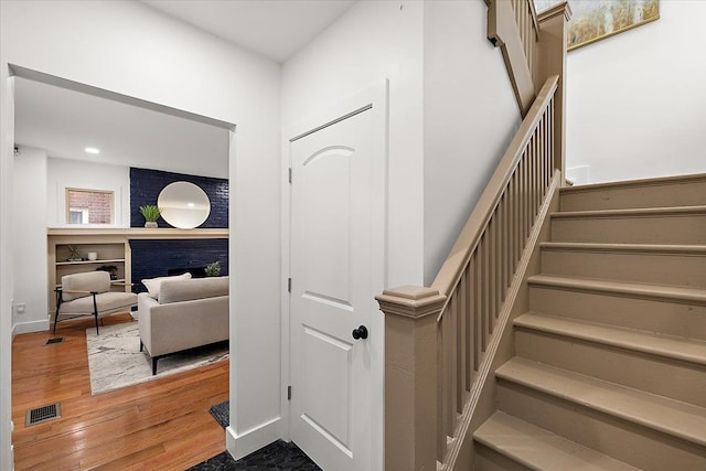 staircase featuring hardwood / wood-style floors