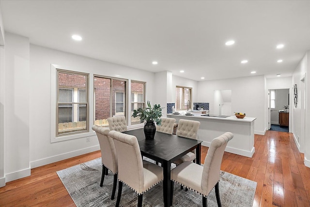 dining space featuring light wood-type flooring