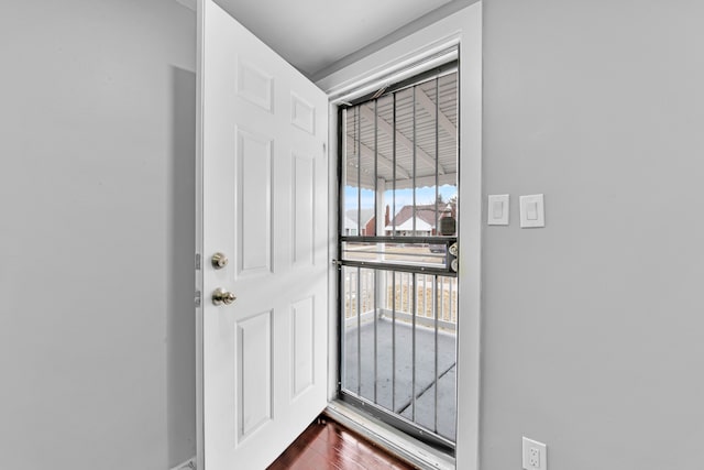 doorway featuring dark wood-type flooring