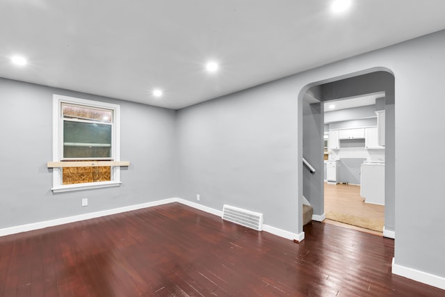 unfurnished room featuring dark hardwood / wood-style floors