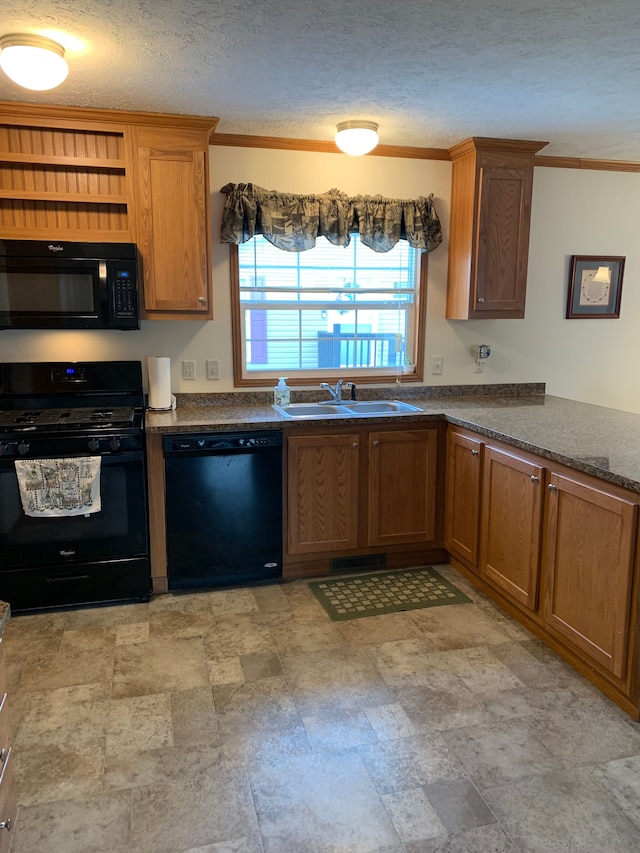 kitchen featuring ornamental molding, sink, a textured ceiling, and black appliances