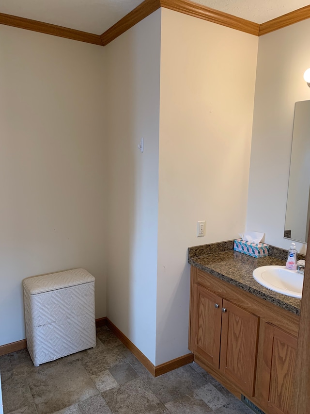 bathroom with vanity and crown molding