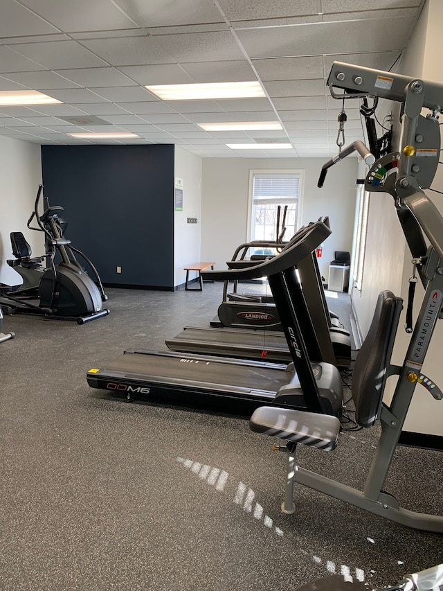 gym featuring a paneled ceiling