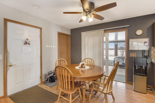 dining area featuring ceiling fan and light hardwood / wood-style flooring