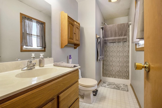 bathroom with vanity, curtained shower, and toilet