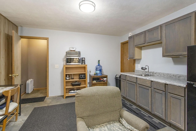 kitchen with sink and a textured ceiling