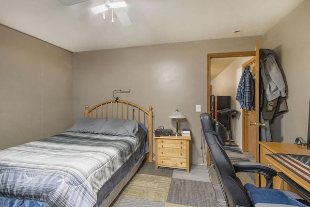 bedroom featuring light colored carpet and ceiling fan