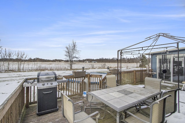 dock area featuring a wooden deck, a gazebo, and a rural view