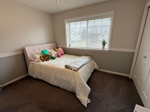 bedroom featuring dark colored carpet