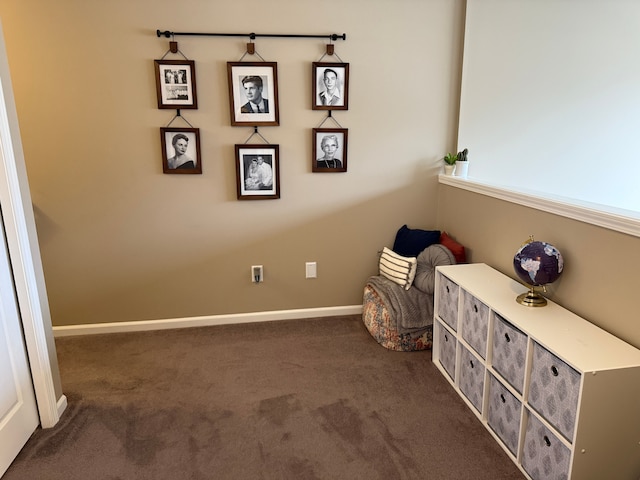 unfurnished room with dark colored carpet