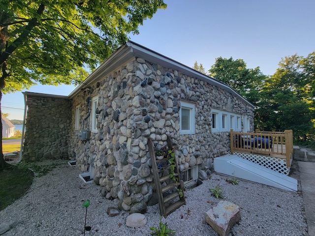 view of side of home featuring a deck