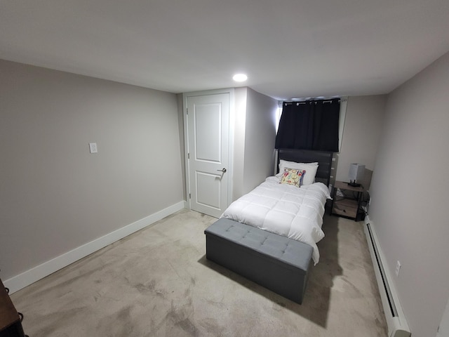 bedroom featuring a baseboard heating unit