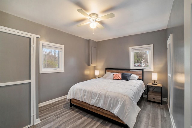 bedroom featuring hardwood / wood-style flooring and ceiling fan