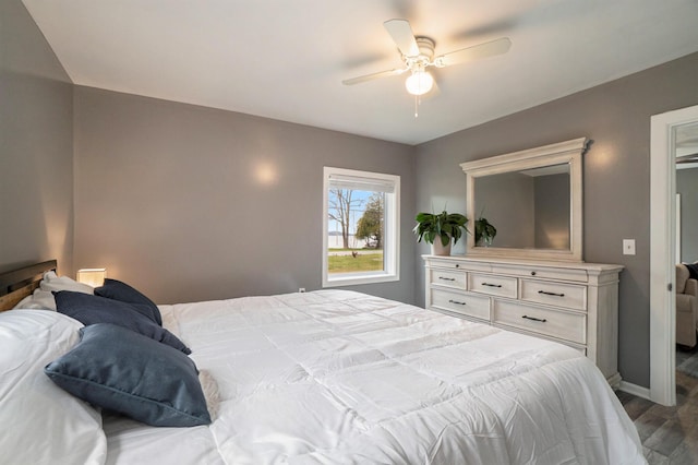 bedroom with hardwood / wood-style flooring and ceiling fan