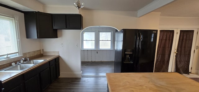 kitchen with dark hardwood / wood-style floors, sink, crown molding, plenty of natural light, and black refrigerator with ice dispenser