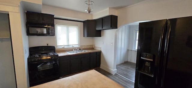 kitchen with dark brown cabinetry, sink, crown molding, hardwood / wood-style floors, and black appliances