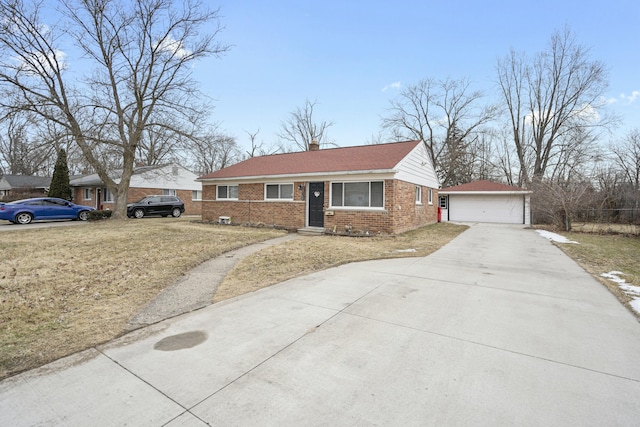 single story home with a garage and an outdoor structure