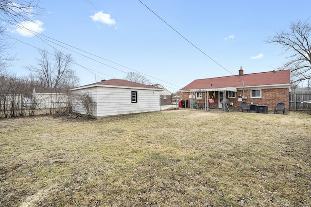 rear view of house with a lawn