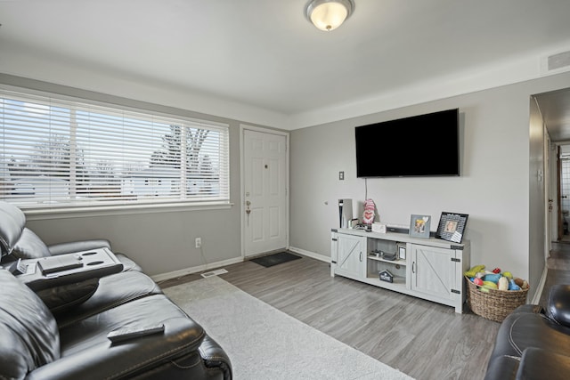 living room with light hardwood / wood-style floors