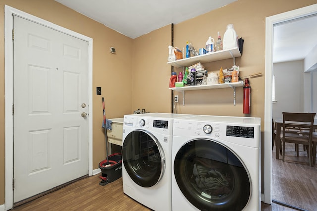 washroom featuring wood-type flooring and washer and dryer