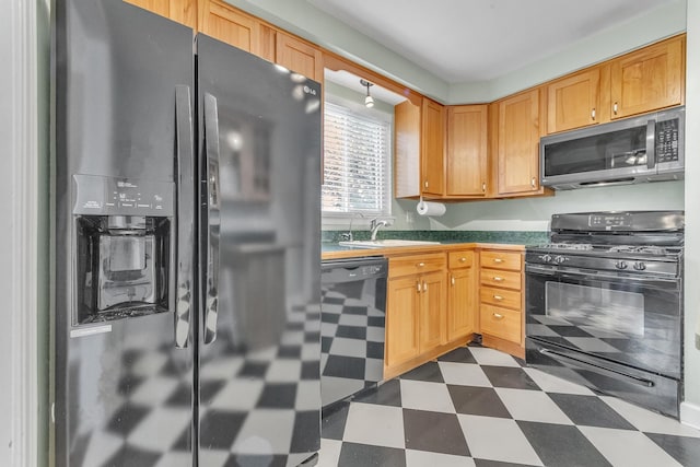 kitchen with sink and black appliances