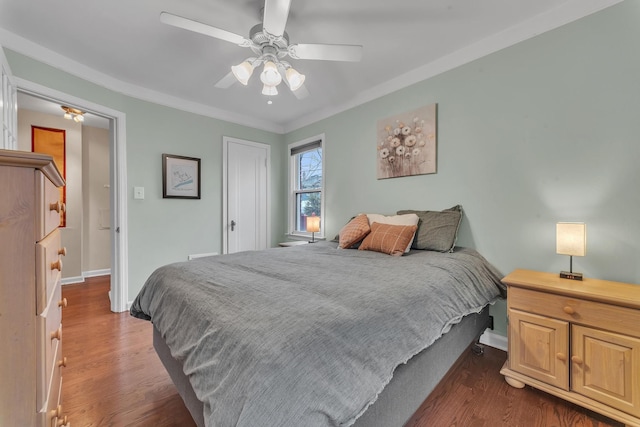 bedroom featuring dark wood-type flooring and ceiling fan