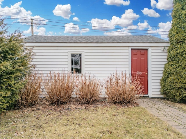 view of outbuilding featuring a yard