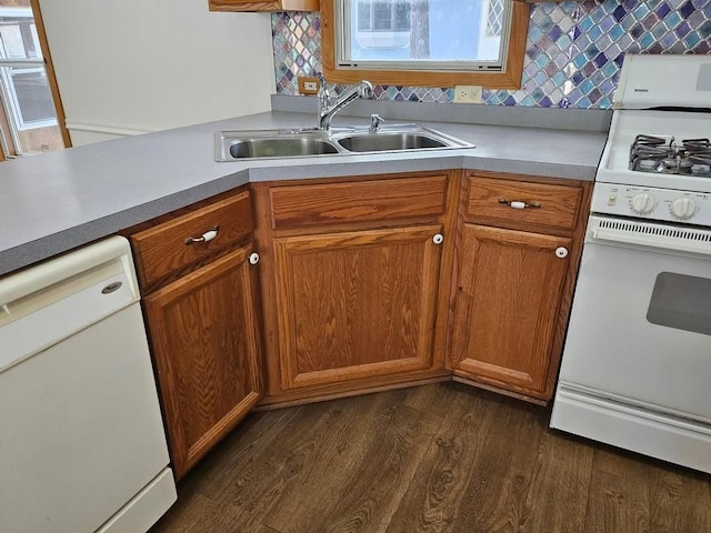 2054 Woodside Dr, Caro, MI 48723 - kitchen with white appliances, a sink, dark wood-type flooring, tasteful backsplash, and light countertops