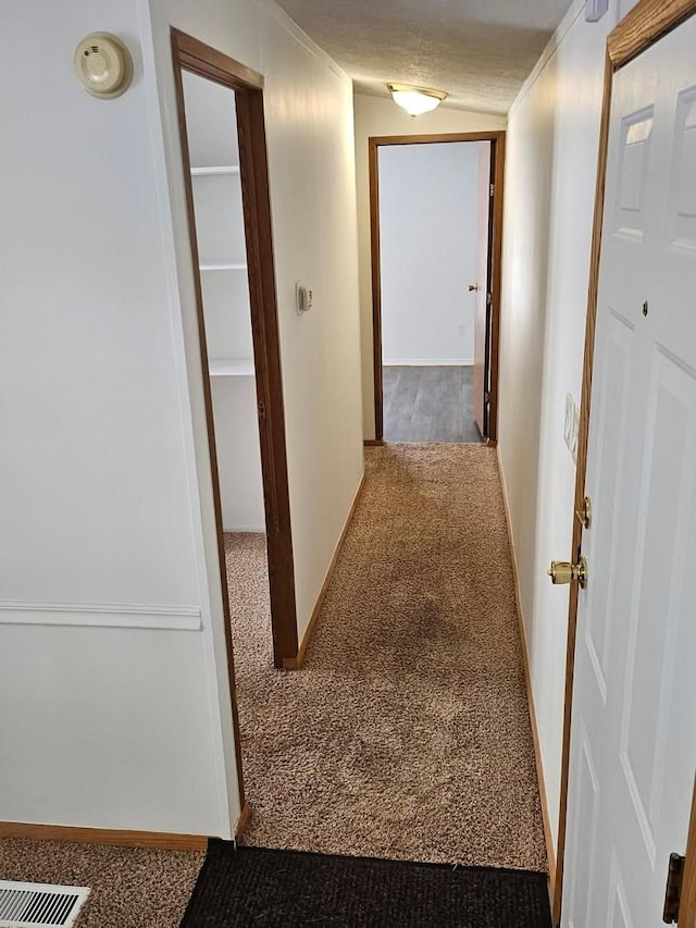2054 Woodside Dr, Caro, MI 48723 - corridor featuring carpet flooring, baseboards, and crown molding