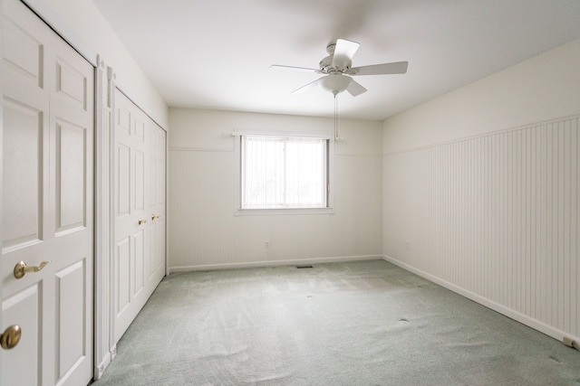 unfurnished bedroom with light carpet and ceiling fan