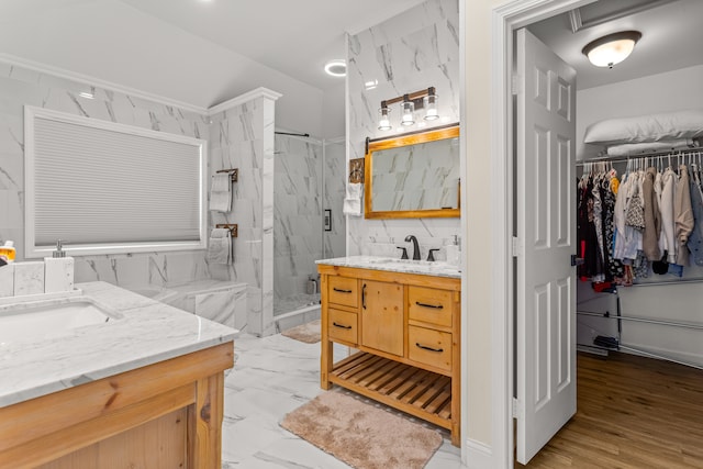 bathroom featuring vanity and a shower with shower door