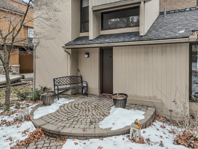 view of snow covered property entrance