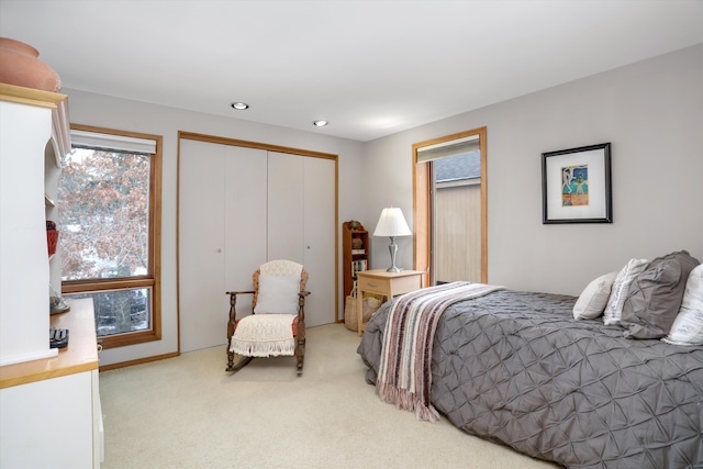 carpeted bedroom featuring a closet