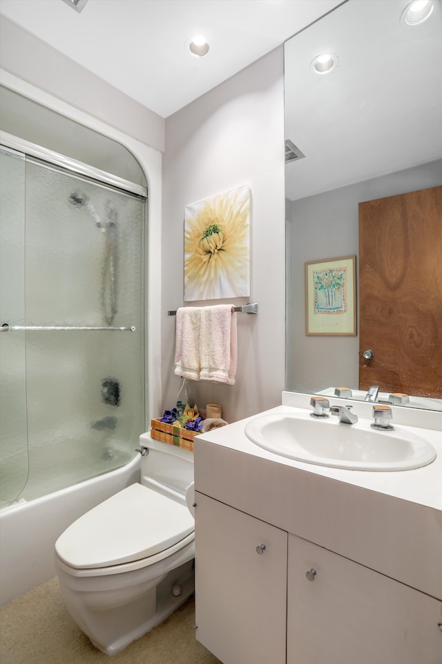 full bathroom featuring vanity, bathing tub / shower combination, and toilet