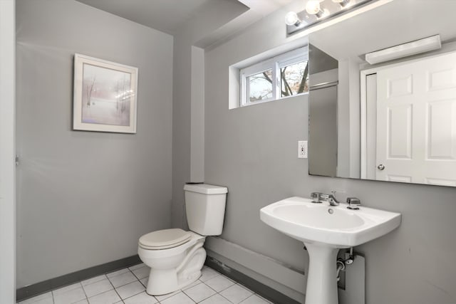 bathroom with tile patterned flooring and toilet