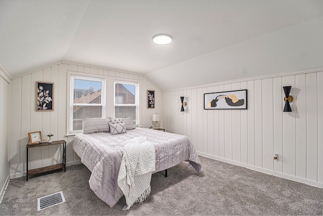 carpeted bedroom with vaulted ceiling