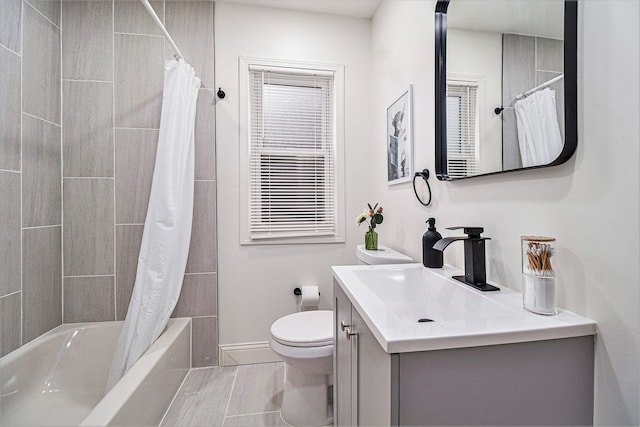 full bathroom with vanity, toilet, and shower / tub combo