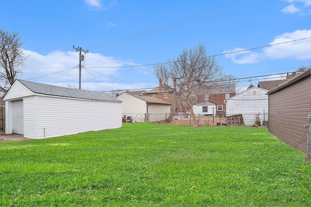 view of yard with an outbuilding and a garage