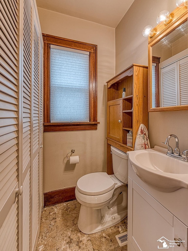 bathroom with vanity and toilet