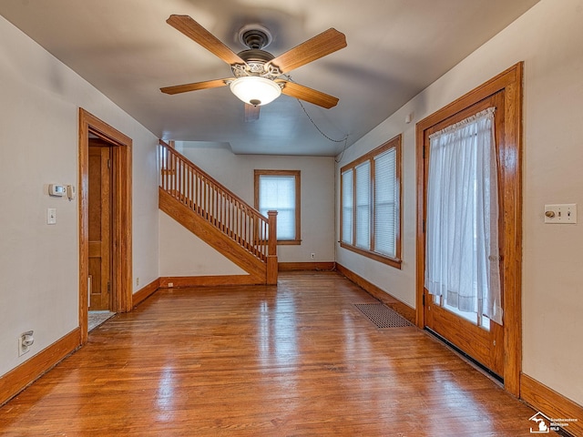 foyer entrance featuring ceiling fan and light hardwood / wood-style floors