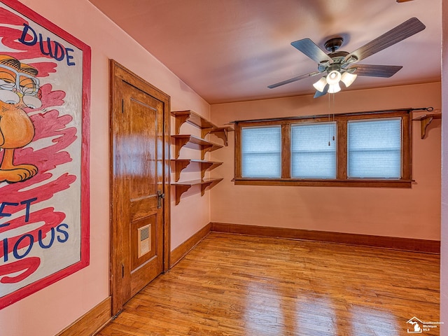 spare room with ceiling fan and light hardwood / wood-style flooring