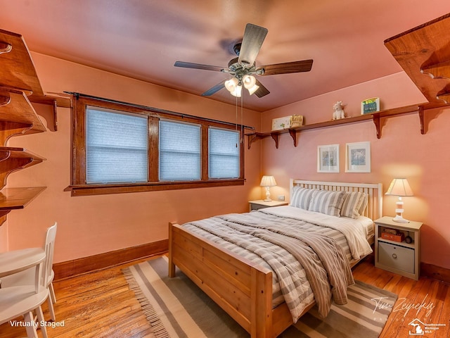 bedroom featuring light hardwood / wood-style flooring and ceiling fan