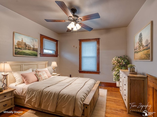 bedroom featuring ceiling fan and light wood-type flooring