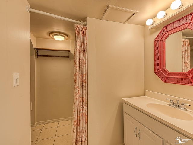 bathroom with tile patterned flooring and vanity