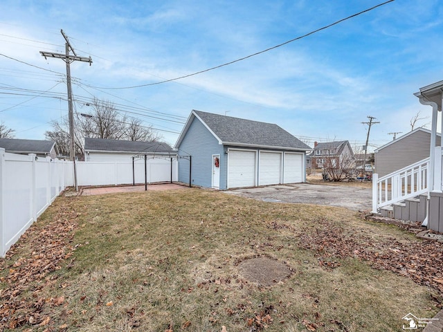 exterior space with a garage and an outdoor structure