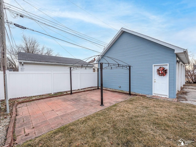 view of outbuilding featuring a lawn